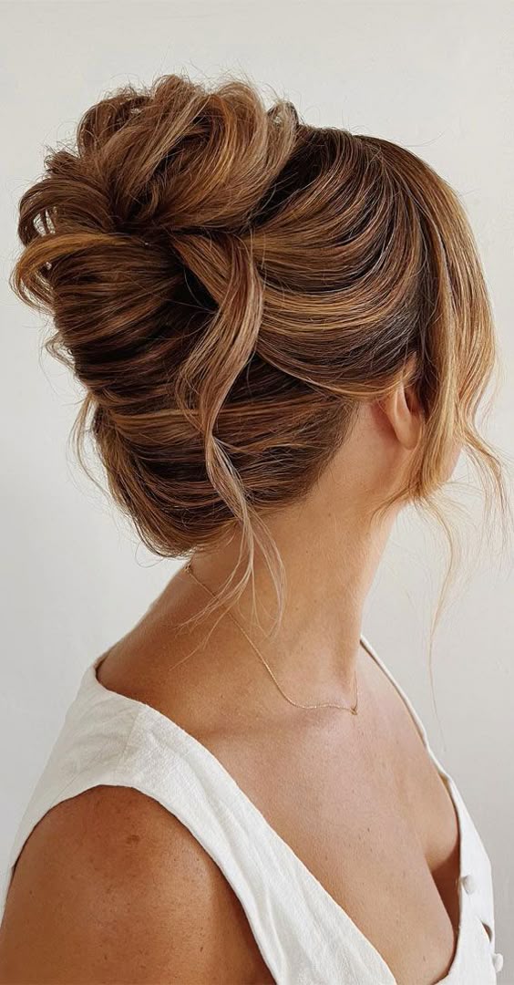 updo hairstyles messy chignon with strands 
